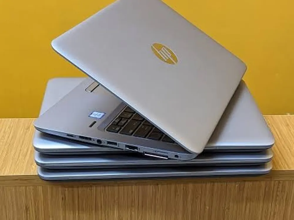Stack of refurbished HP EliteBook laptops in stock at Gervlink Solutions Kisumu