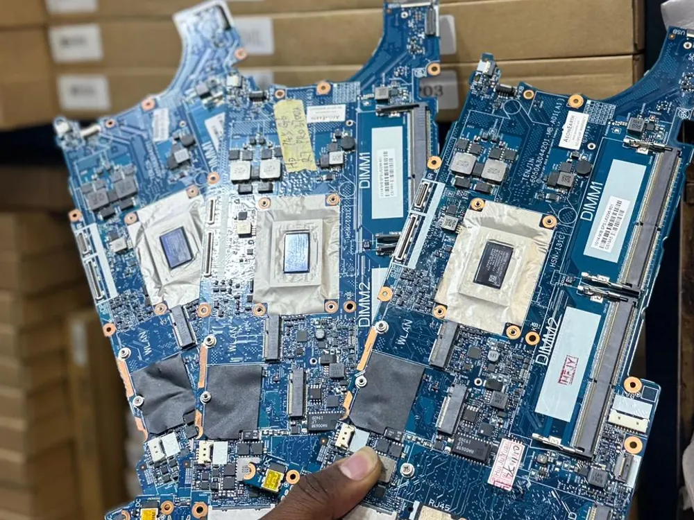 Replacement laptop motherboards held in the Gervlink Solutions workshop