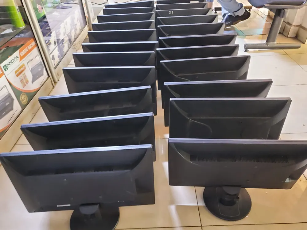 Row of refurbished computer monitors in various sizes in the Kisumu shop